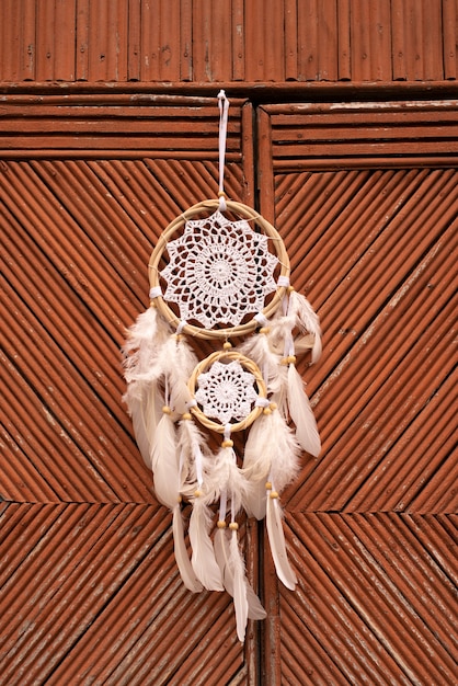 Free photo dreamcatcher placed at the door