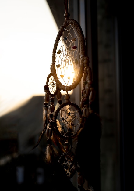 Free Photo dreamcatcher placed on a patterned wall