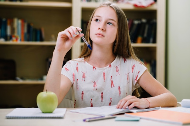 Free photo dreamy girl studying