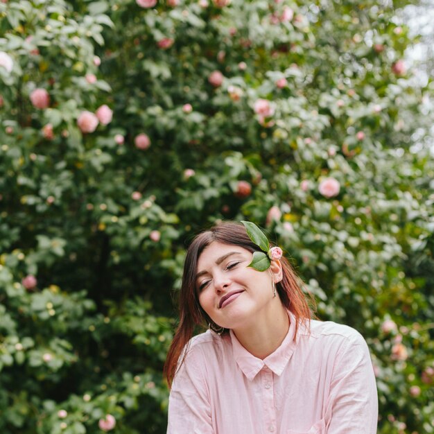 Dreamy pretty girl with flowers in hair 