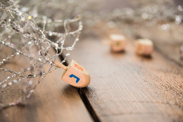 Dreidel near shiny decoration