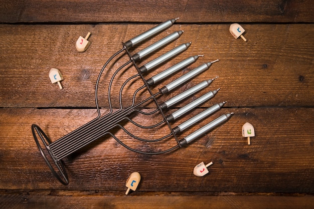 Free Photo dreidels lying around menorah