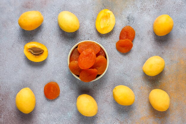 Dried apricots with fresh juicy apricot fruits,top view