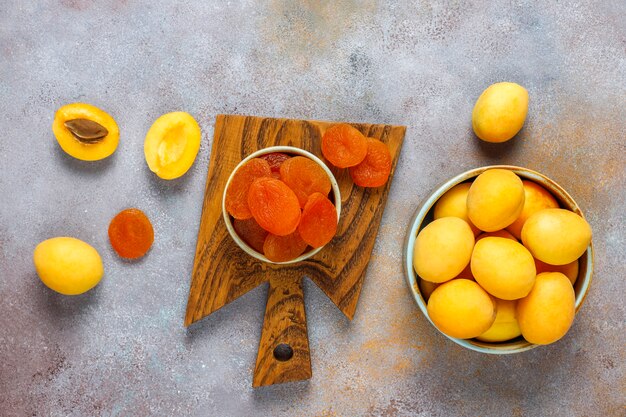 Dried apricots with fresh juicy apricot fruits,top view