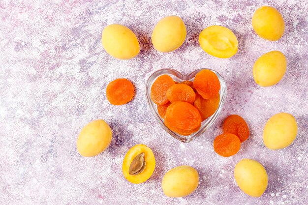 Dried apricots with fresh juicy apricot fruits,top view