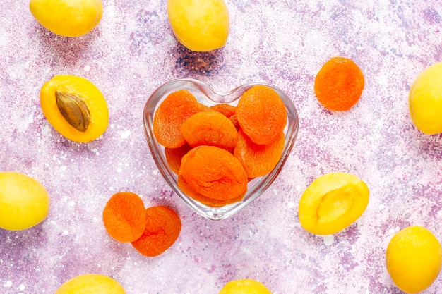 Dried apricots with fresh juicy apricot fruits,top view