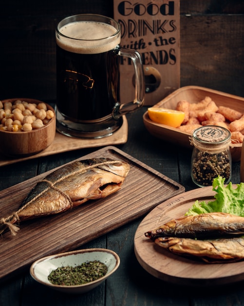 Dried fishes and glass of beer