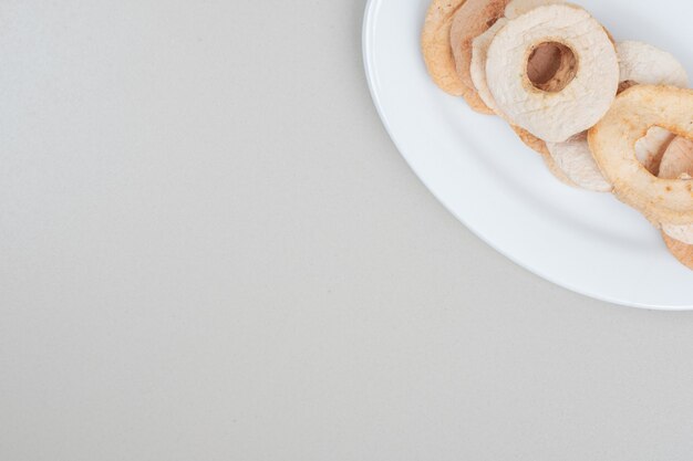 Dried fruit slices on white plate