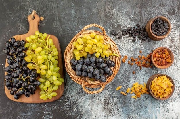 dried fruits the appetizing grapes in the basket and on the board dried fruits