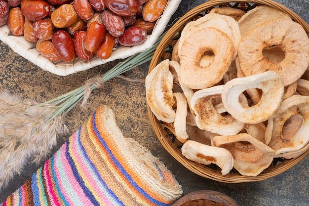 Dried fruits in wooden bowl on marble background.High quality photo