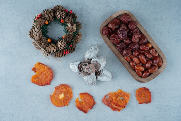 Dried healthy orange with basket full of nuts. High quality photo