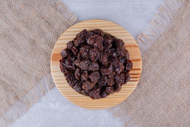 Dried sour cherries isolated in a plate on the background. High quality photo