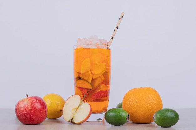 Free photo drink with apple, feijoa and straw on white