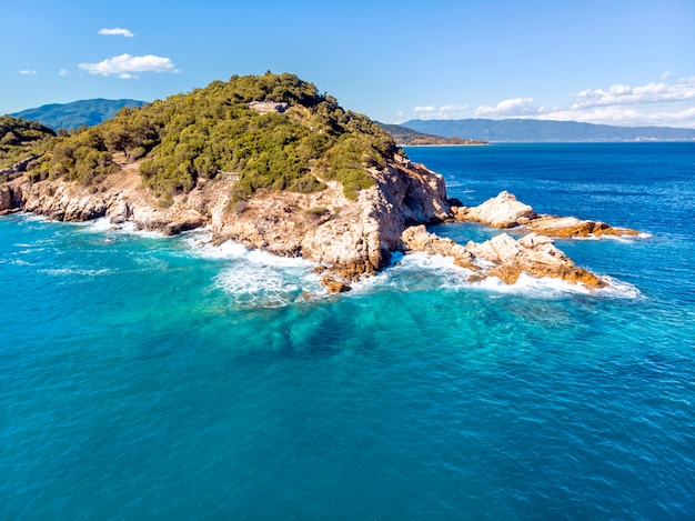 Drone aerial view of sea and rocks in Olympiada Halkidiki Greece