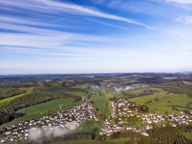 Drone photography of beautiful green fields of the countryside on a sunny day