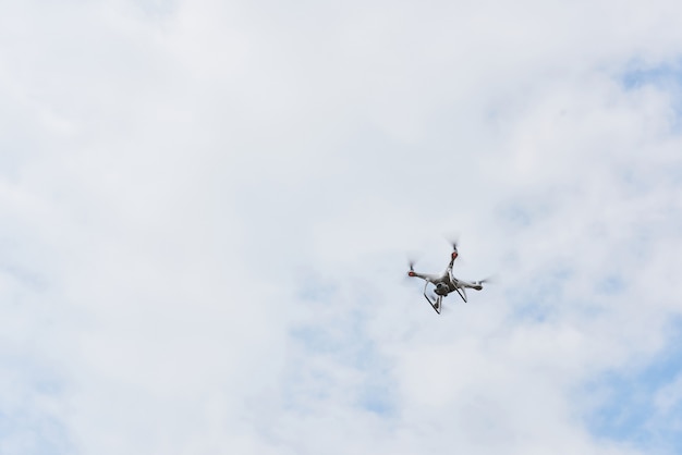 Drone quad copter with high resolution digital camera on the sky.