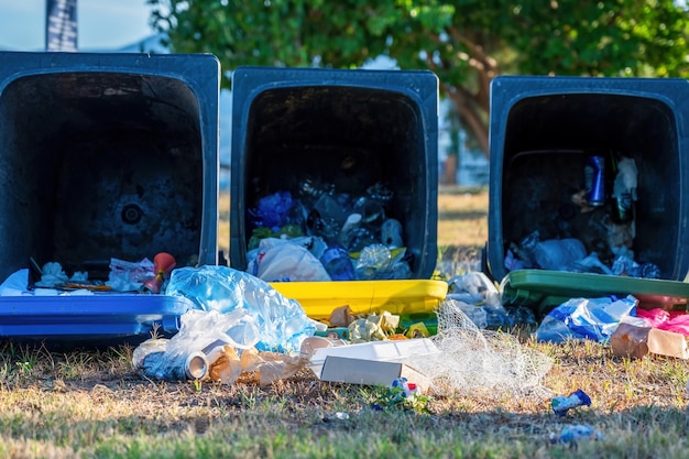 Free photo dropped dumpsters with fallen out trash on the ground