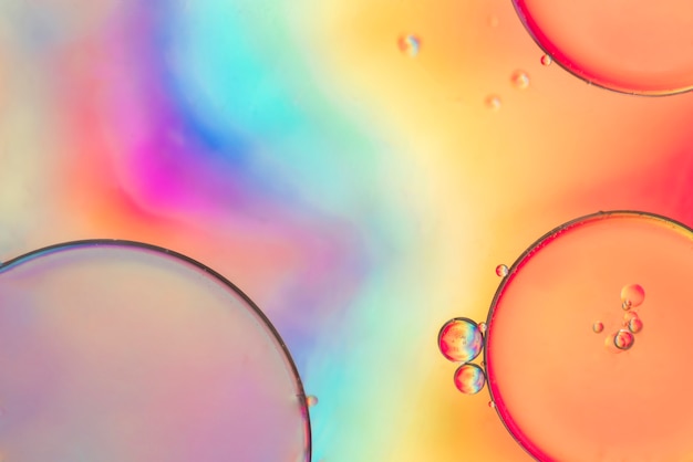 Free photo drops of water at multicoloured surface