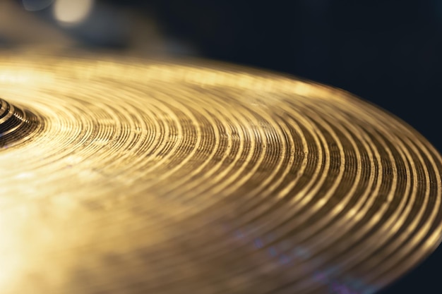 Free Photo drum cymbal closeup on a dark background