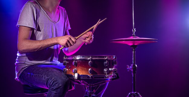 The drummer plays the drums