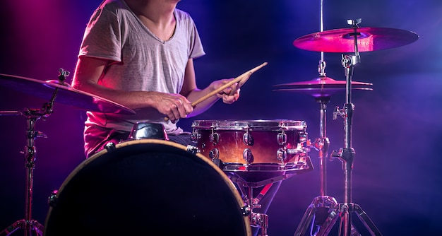 The drummer plays the drums