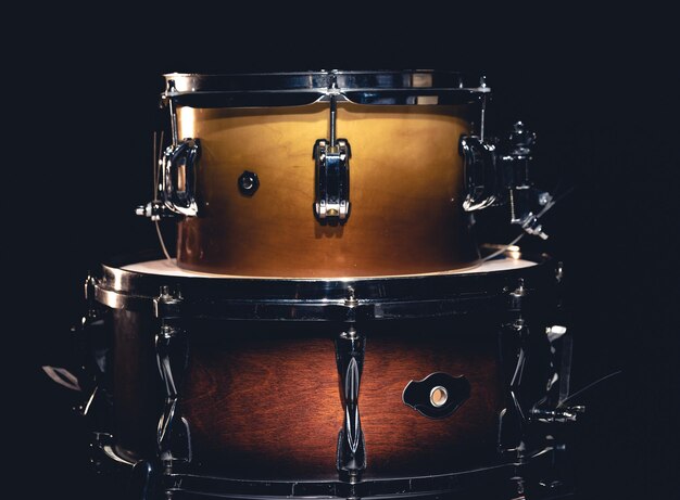 Drums on a dark background isolated percussion instruments