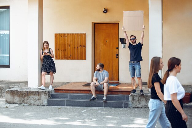 Free Photo dude with sign - man stands protesting things that annoy her