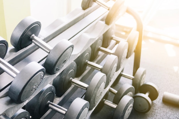 Free photo dumbbells on rack