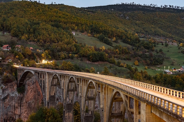 Free photo durdevica tara arc bridge in the autumn mountains montenegro