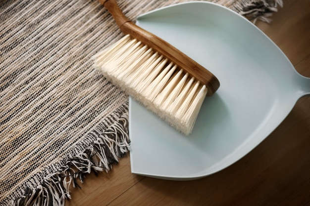 Free photo dustpan and cleaning brush living essentials in lifestyle concept