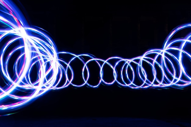 Free photo dynamic light painting  with dark background