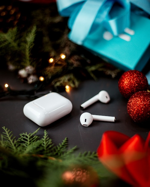 Earphones with charging box on the table