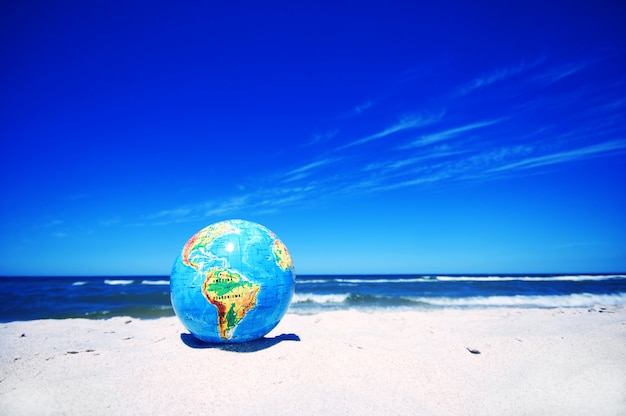 Free photo earth planet on sandy beach