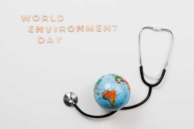 Free Photo earth over stethoscope and text world environment day 