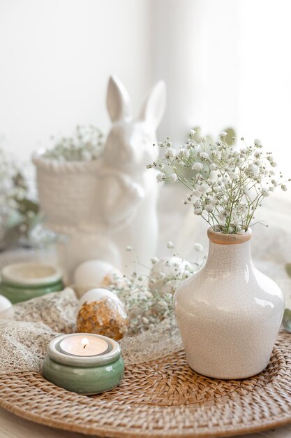 Easter composition with a ceramic hare and gypsophila flowers