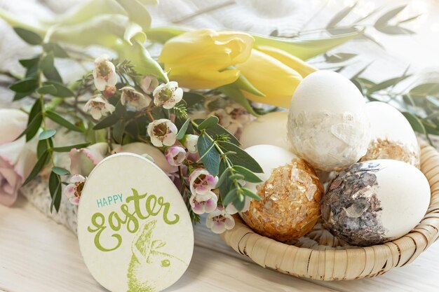 Free Photo easter composition with decorative eggs and flowers closeup