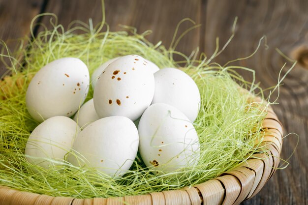 Easter composition with eggs in a decorative nest