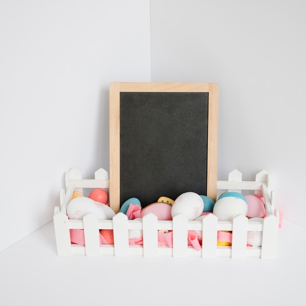 Easter eggs and blank blackboard