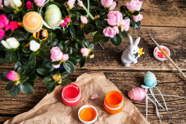 Free photo easter eggs decorated in diverse colors on the foreground of the easter rabbit and watercolors