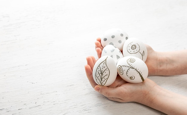 Free Photo easter eggs handpainted in children39s hands on a white background