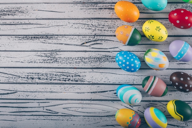 Easter eggs on light wooden background.