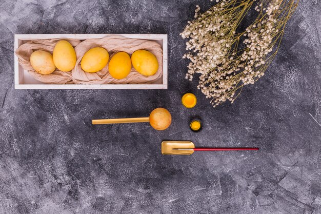 Easter eggs with paint brush and flowers