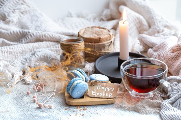 Easter mood, Cozy Easter still life with decor by the window. Morning tea with dessert.