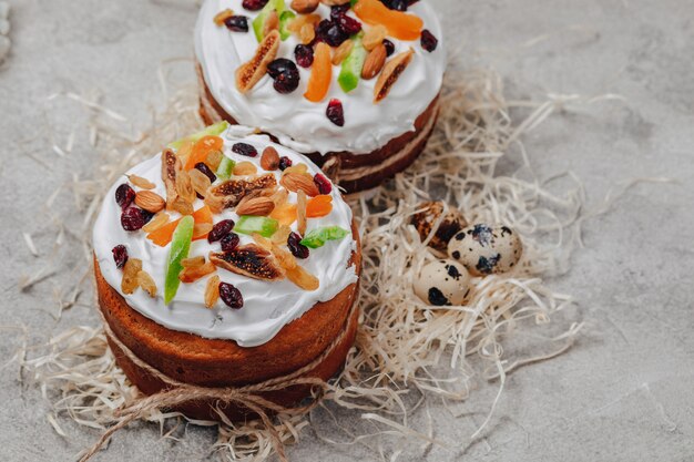 Easter pastries and eggs on a concrete background