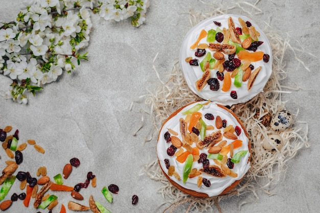 Easter pastries and eggs on a concrete background