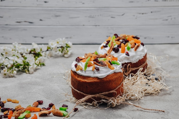 Easter pastries and eggs on a concrete background