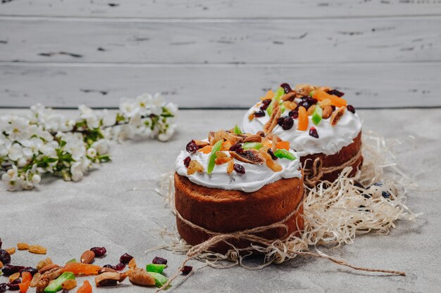 Easter pastries and eggs on a concrete background