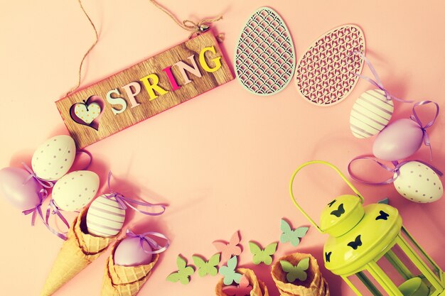 Easter Spring Concept. Flat Lay or Top View of Easter Eggs and Ice Cream Cones. Easter or Spring Background with Place for Text.