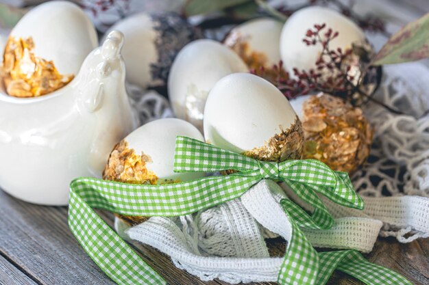 Easter still life with eggs decorated by hand on a wooden surface