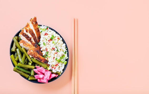 Eastern cuisine. Japanese style grilled chicken rice, ready to eat, laid out against a bright background. Juicy chicken teriyaki sauce framed in a simple concept.